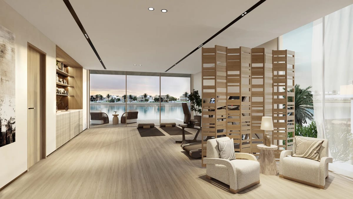 Multi-purpose family room arranged as a lounge and private gym, facing the water.