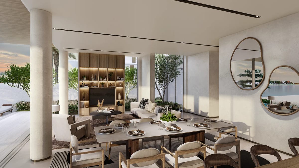 Open-plan living room with a full-height joinery wall, floor-to-ceiling glazing and views through to the garden.