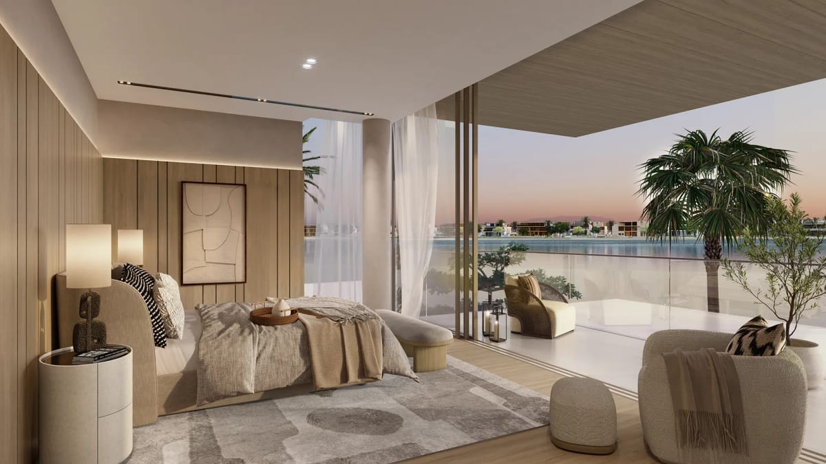 Master bedroom at dusk, opening onto a private terrace above the water.